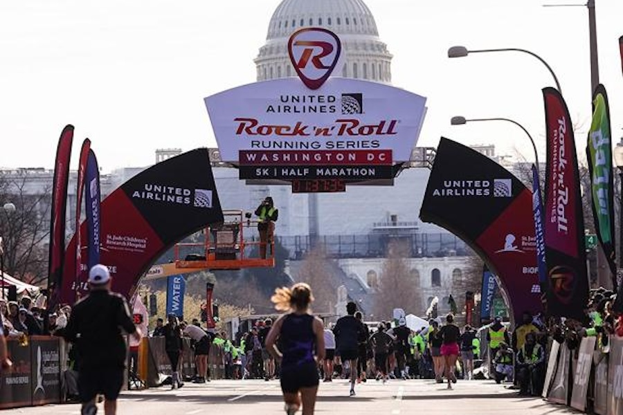 Runners approach the finish line of the United Airlines Rock ‘n’ Roll Running Series in Washington, DC, with the U.S. Capitol in the background.