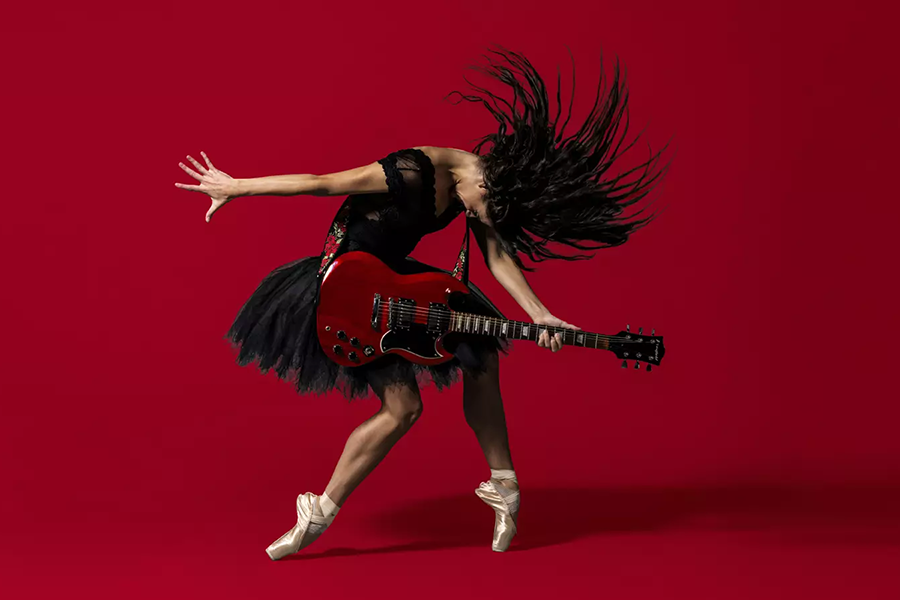 Picture of Woman strumming guitar and dancing ballet