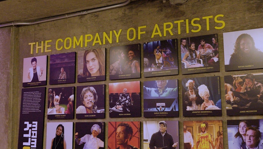 Wall display reading “THE COMPANY OF ARTISTS” with a grid of performer photos at Woolly Mammoth Theatre Company in Washington, DC.