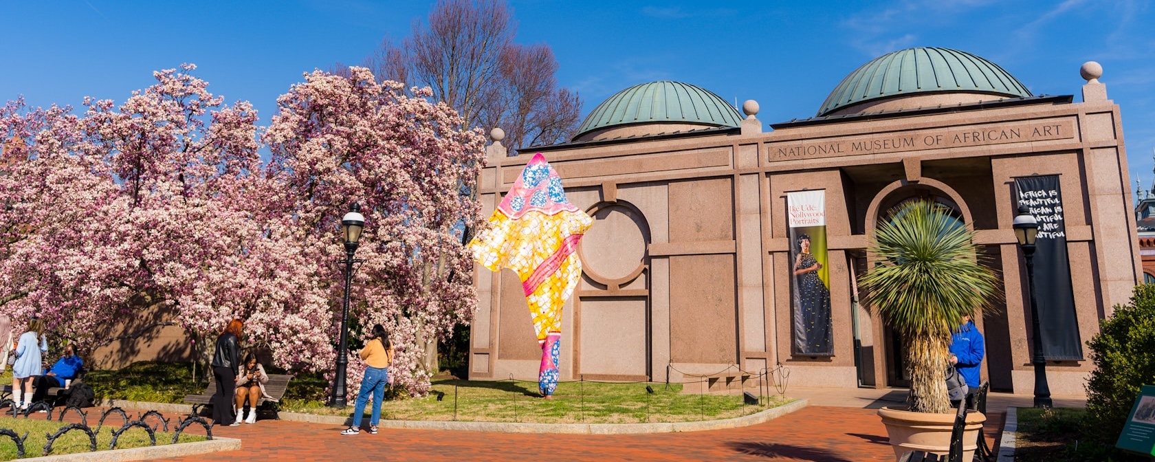 An exterior view of the Smithsonian's National Museum of African Art on a sunny spring day.