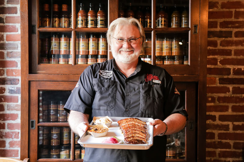 Celebrity chef Myron Mixon with barbecue plate - Where to eat in historic Old Town Alexandria