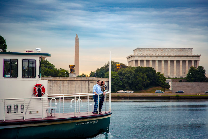 Couple on water taxi in Potomac River by Lincoln Memorial - Waterfront things to do in and around Washington, DC