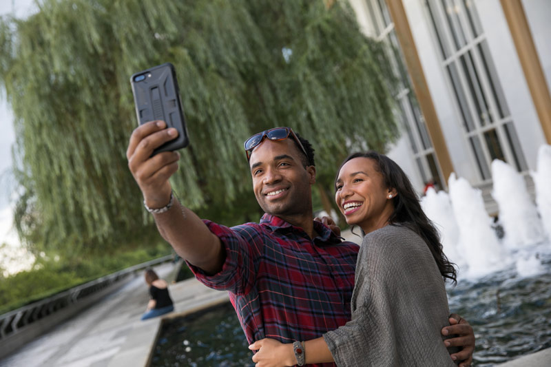 Couple taking selfie on Kennedy Center Terrace - Romantic spots in Washington, DC