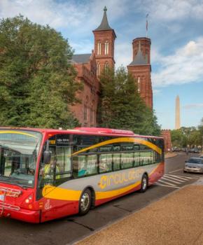 DC Circulator bus on the National Mall in front of the Smithsonian Castle - How to get around Washington, DC