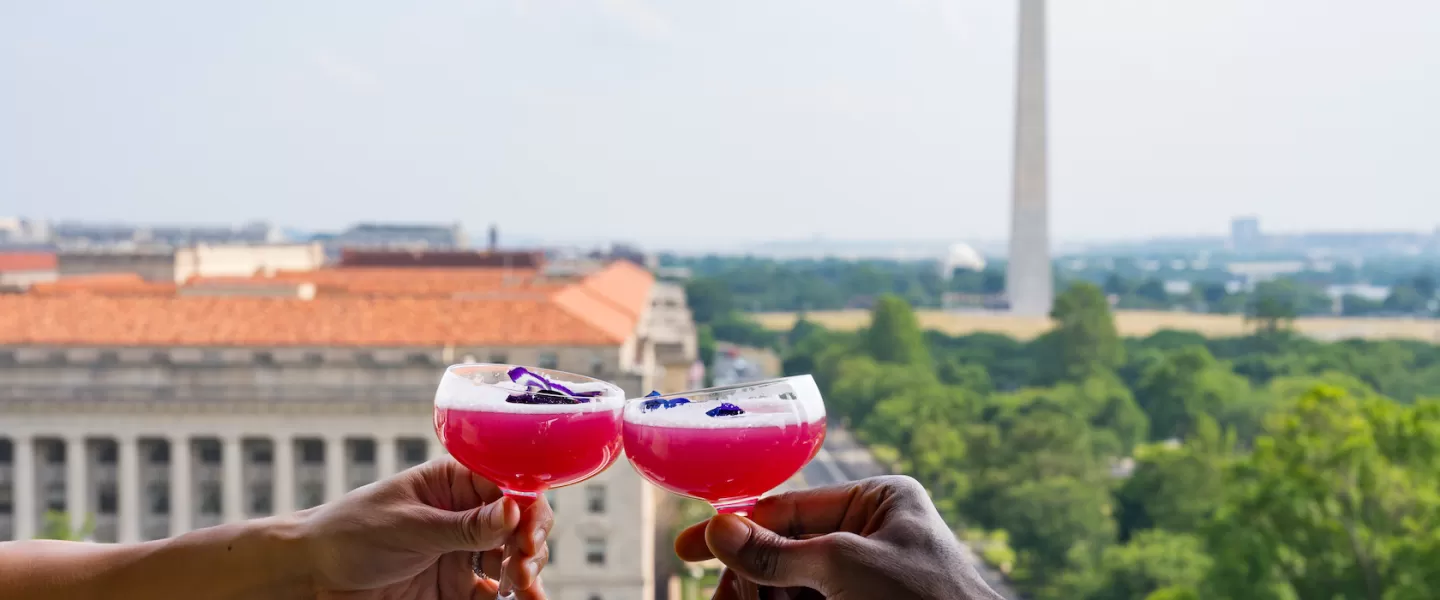 Drinks on top of the Vue with the Washington Monument in the background 