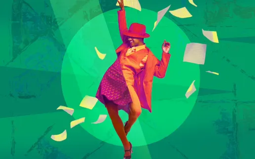 A joyful actor in period costumes dances energetically on stage.
