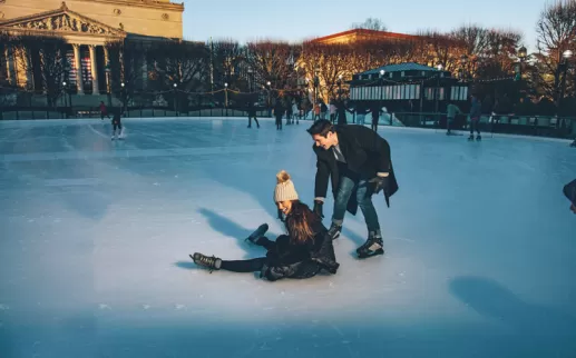 Couple ice skating at the National Gallery of Art Sculpture Garden on the National Mall in Washington, DC