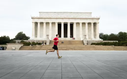 Best running trails and places to jog in Washington, DC - Man running in front of Lincoln Memorial on the National Mall
