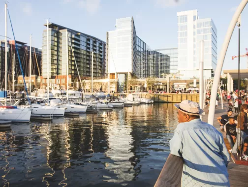 Man standing on the pier overlooking the Wharf