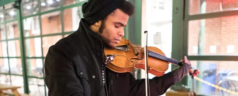 Man playing Violin in Cold Weather